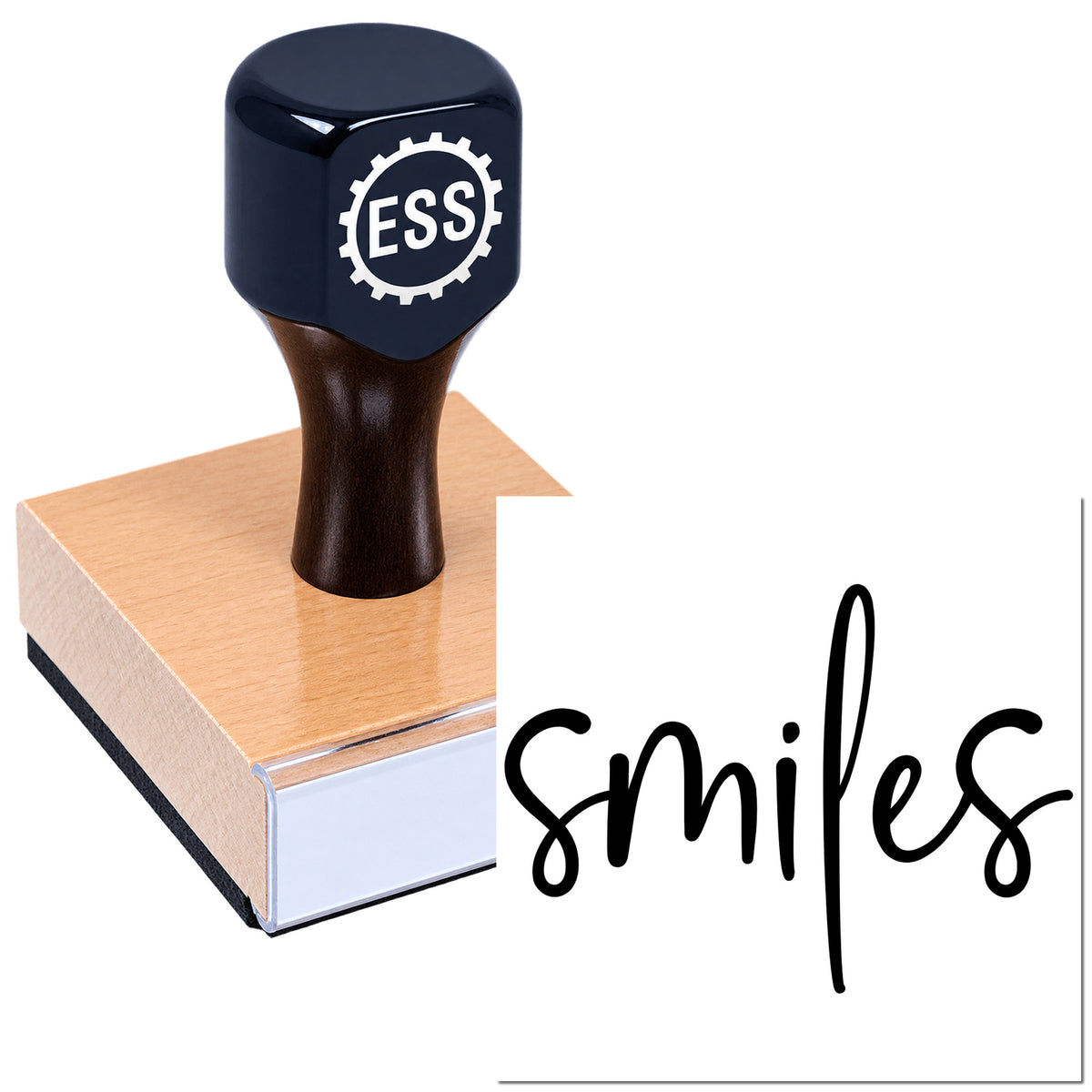 Black ESS custom rubber stamp with silver gear logo on a wooden base and the word smiles.