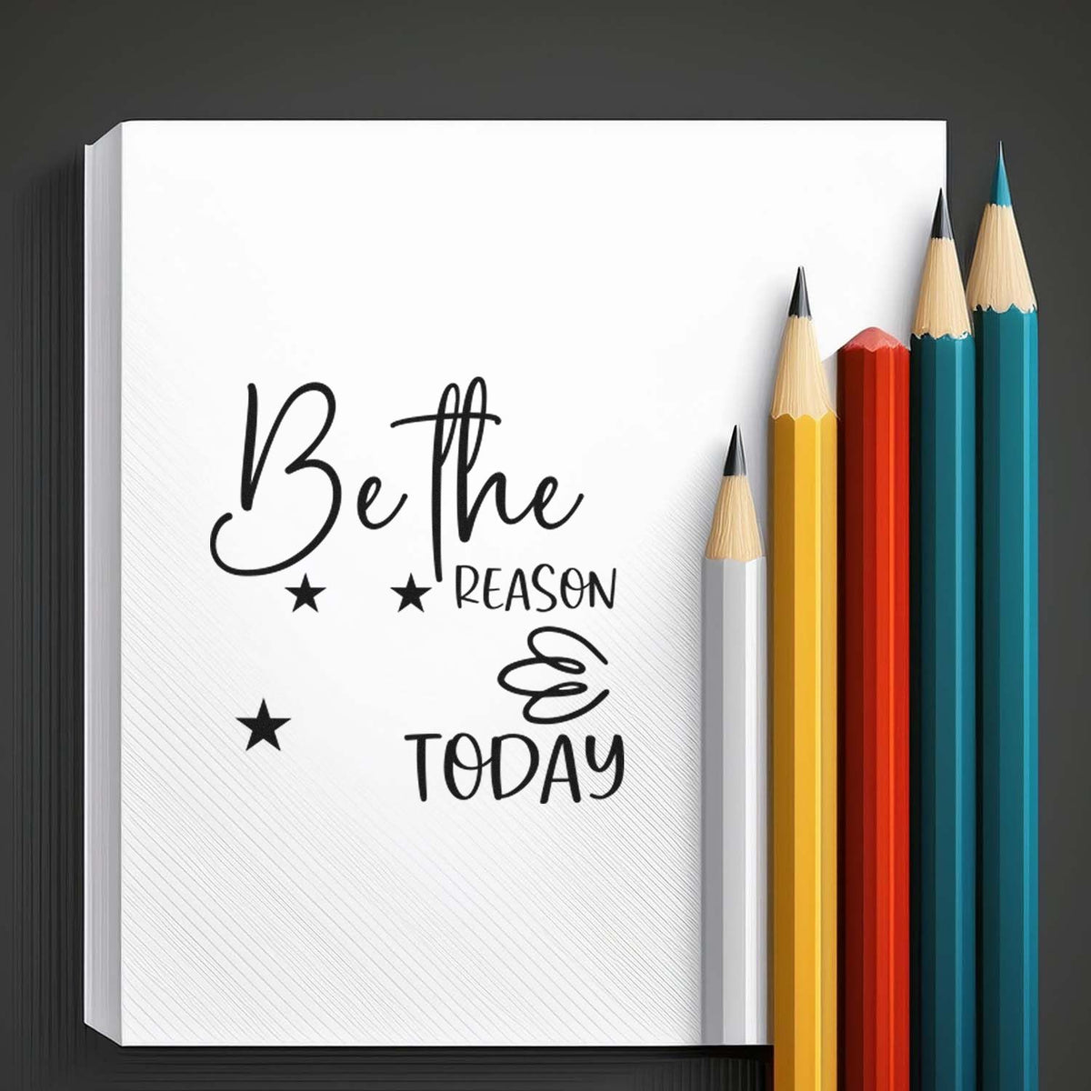Black custom stamp and seal design reading Be the reason ... today on white, with stars and yellow, red, teal pencils.