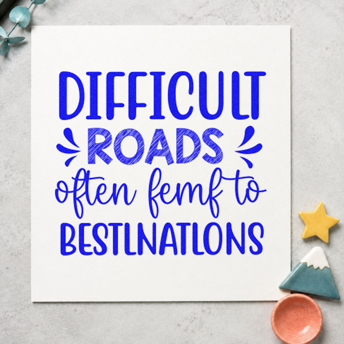 Difficult Roads Decorative Lettering craft stamp imprinted in blue ink on paper, a design suited to framed bike shed.