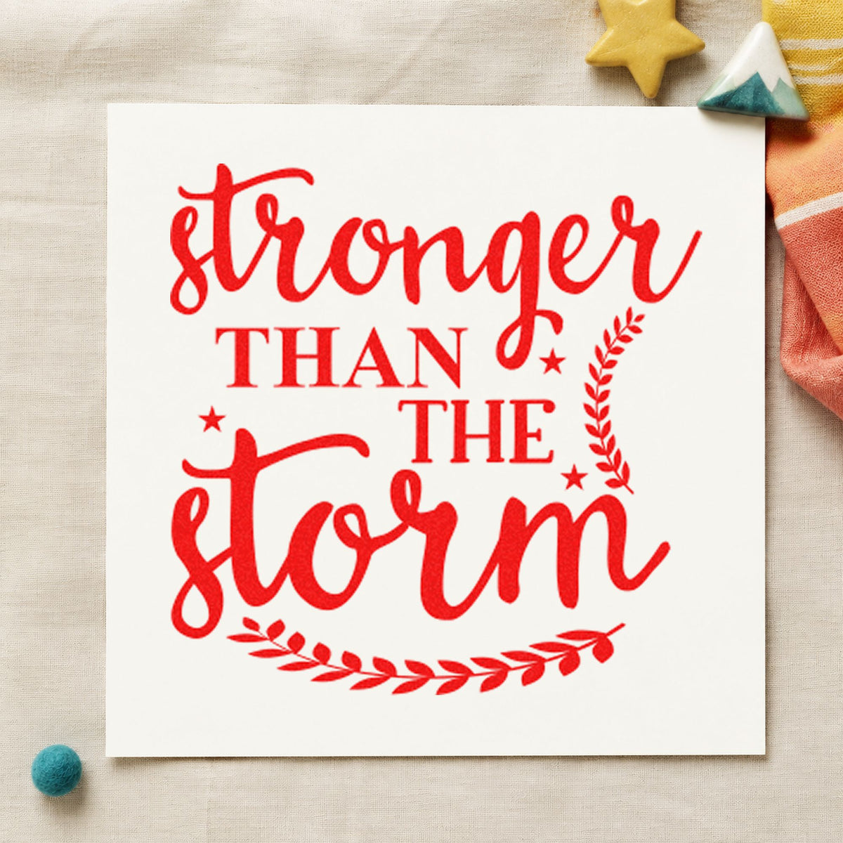 Stronger Than The Storm Leaves rubber stamp shown in red ink, stamped for projects such as tray batch labels.