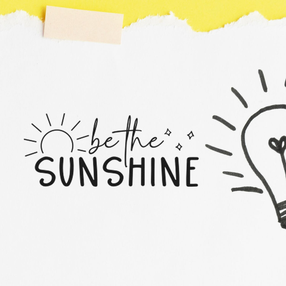 Black be the SUNSHINE stamp and seal design with sun doodle on white paper, yellow torn top edge.