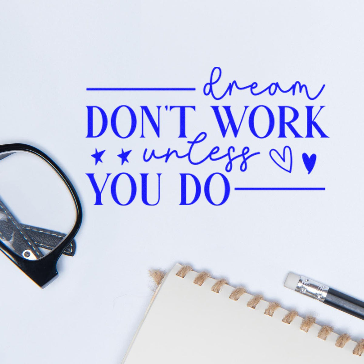 Blue custom stamp seal reading Dream dont work unless you do with stars and hearts on white paper.