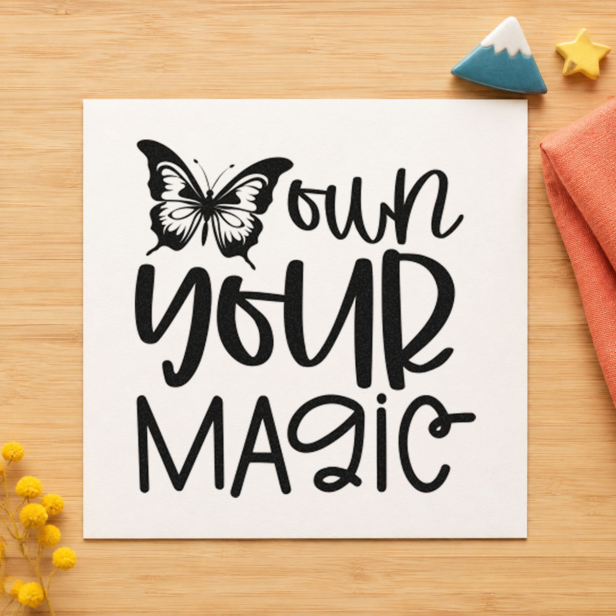 Own Your Magic Butterfly craft stamp imprint in black ink on a handmade project, one idea being kit case gift tags.