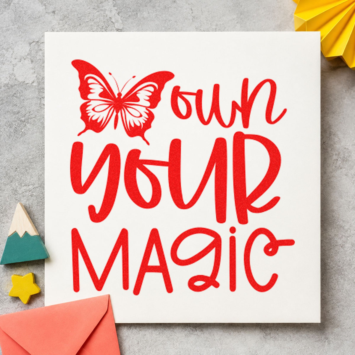 Own Your Magic Butterfly rubber stamp shown in red ink, stamped for projects such as tray color labels.