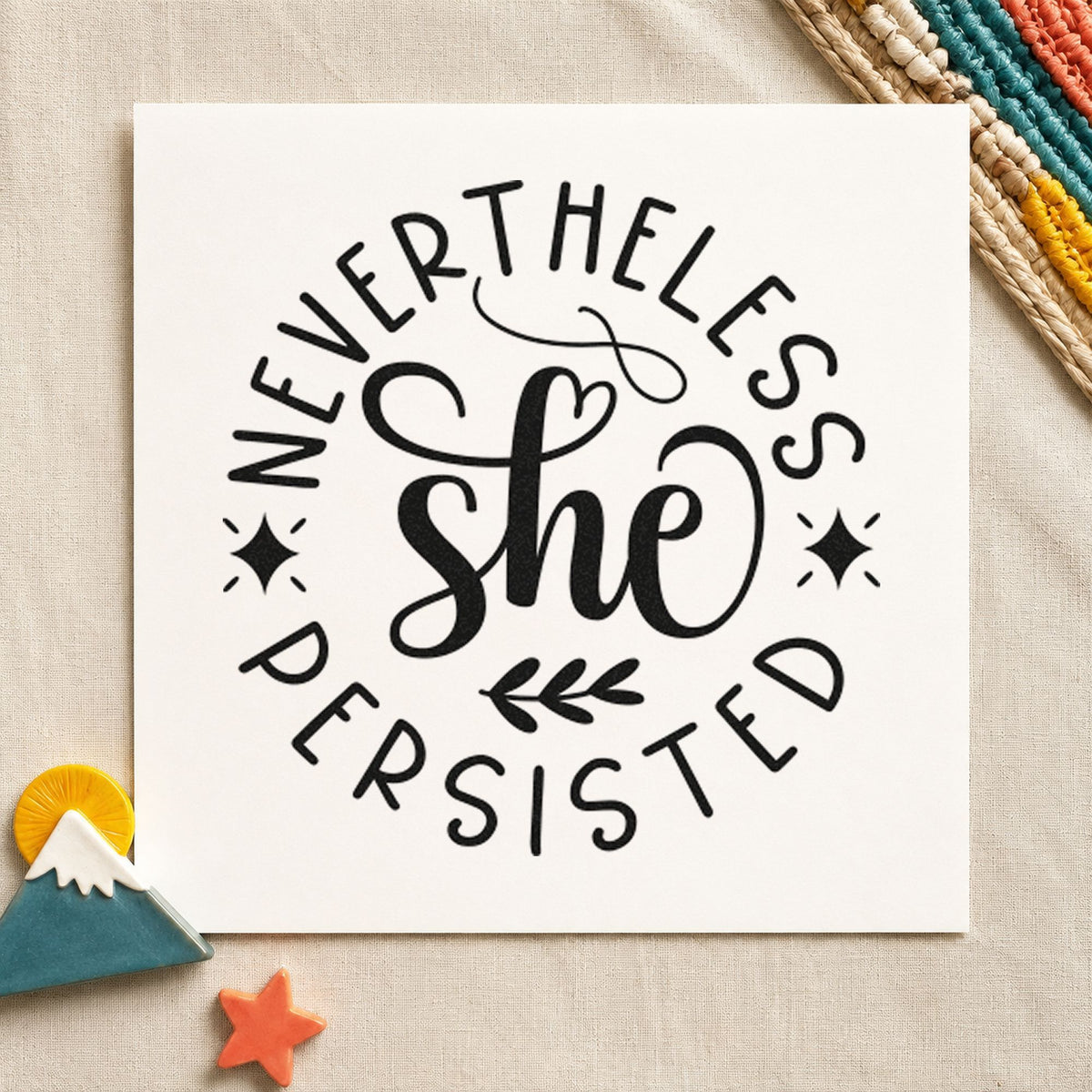 Nevertheless She Persisted Circle craft stamp imprint in black ink on a handmade project, one idea being book pick gift tags.