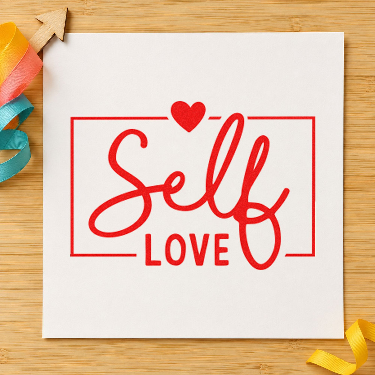 Self Love Framed Heart rubber stamp shown in red ink, stamped for projects such as shelf oil labels.