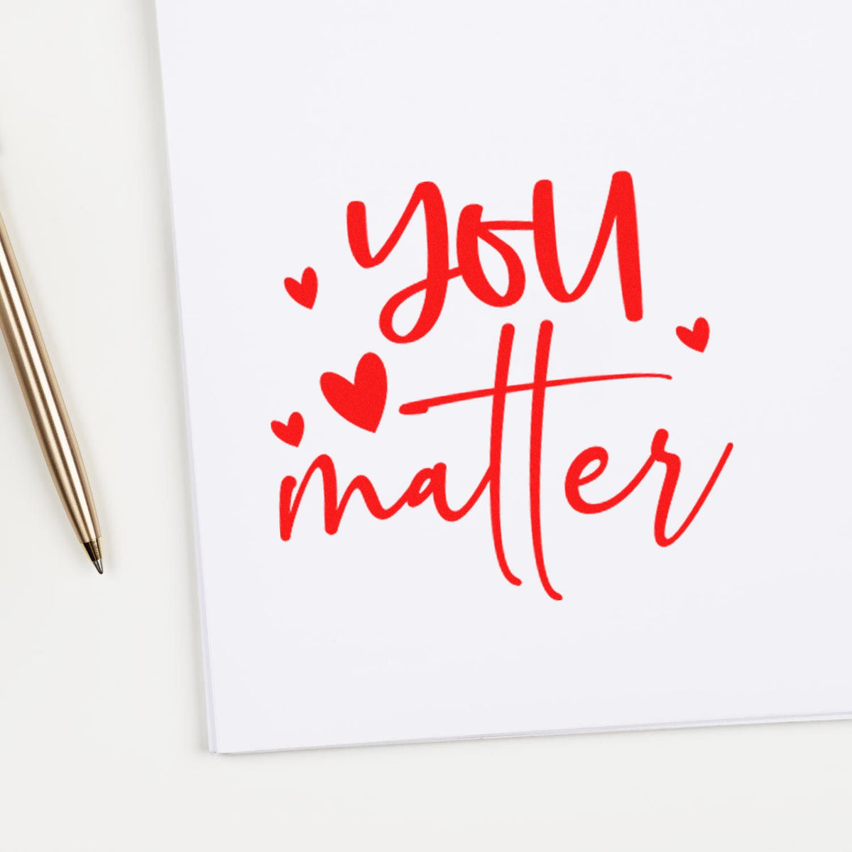You Matter Scattered Hearts rubber stamp shown in red ink, stamped for projects such as school year album page.