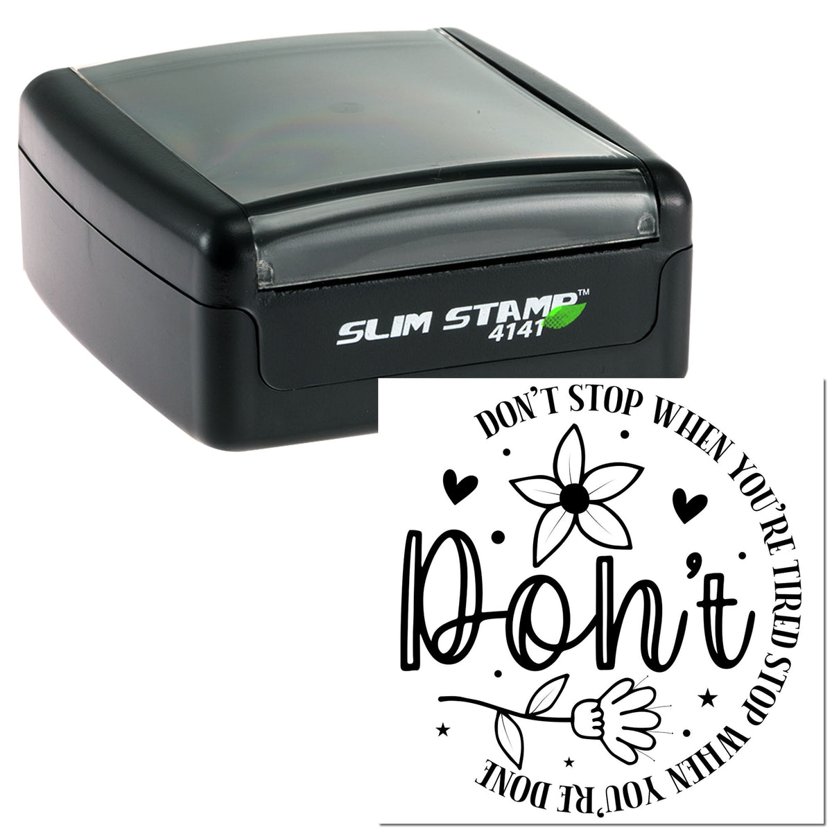 Black slim self-inking stamp with gray translucent cap and decorative round seal design with floral hearts and quote text.