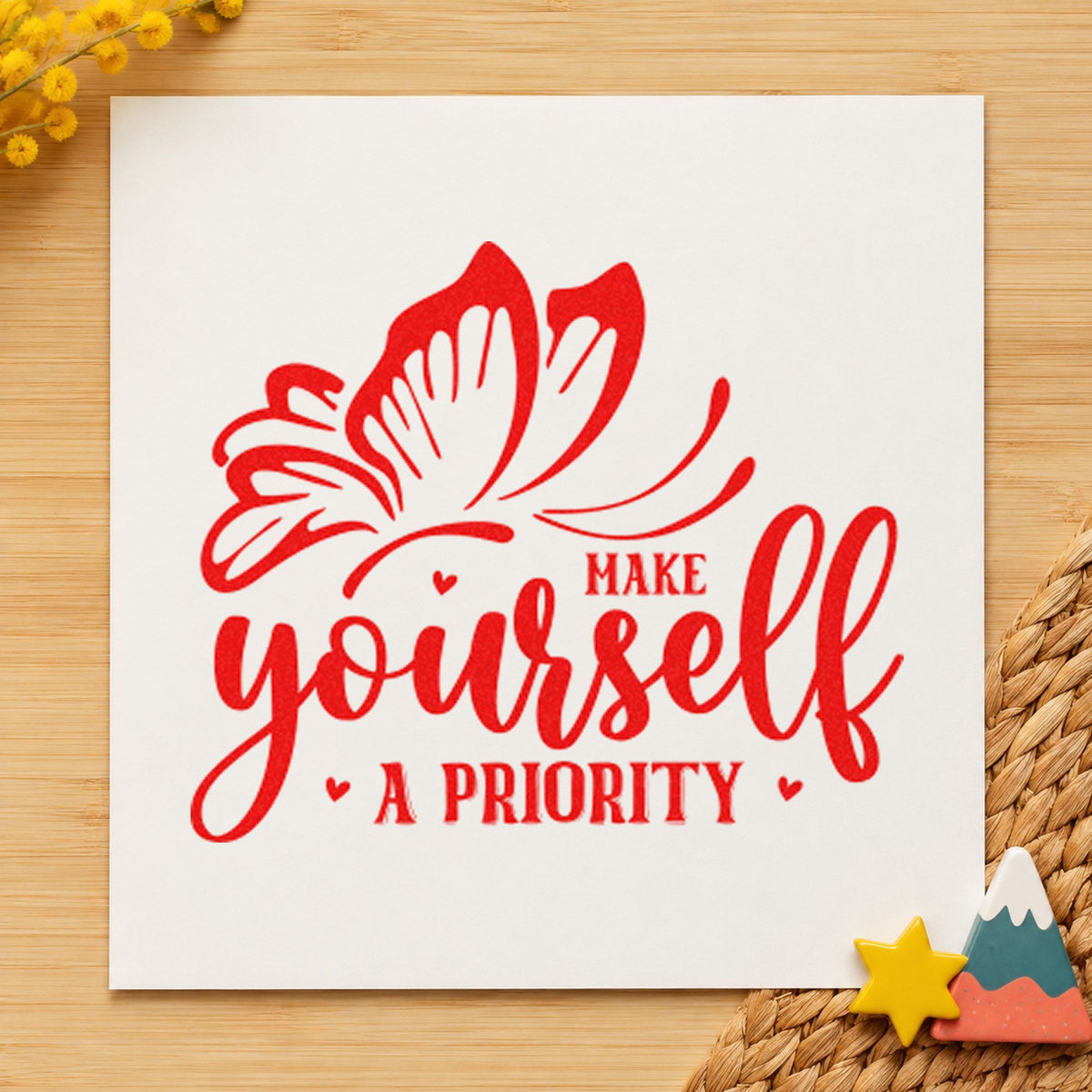 Make Yourself A Priority Butterfly craft stamp imprint in red ink on a handmade project, one idea being step tally cards.