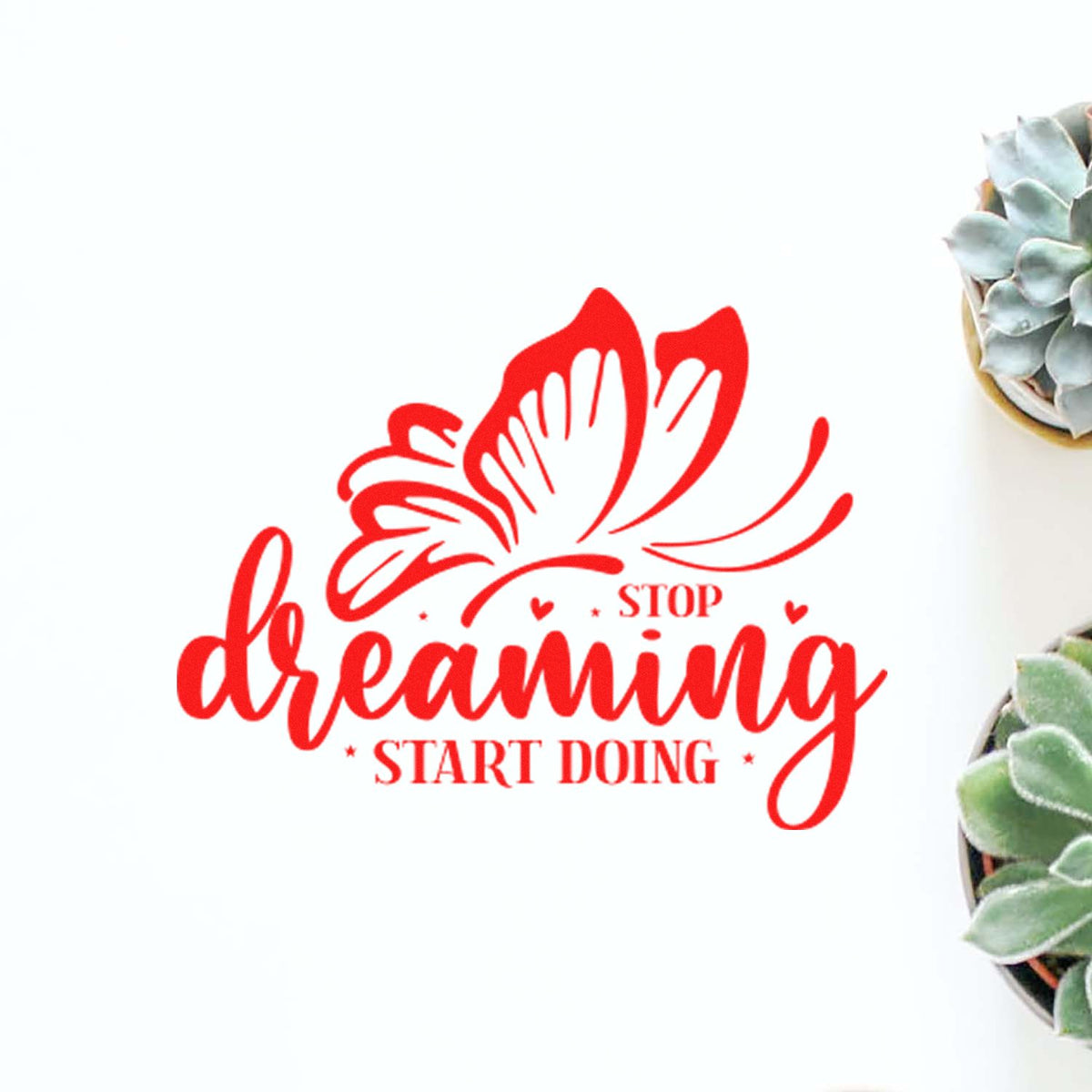 Red floral dream stamp seal with "stop dreaming start doing" text on white, framed by succulents.