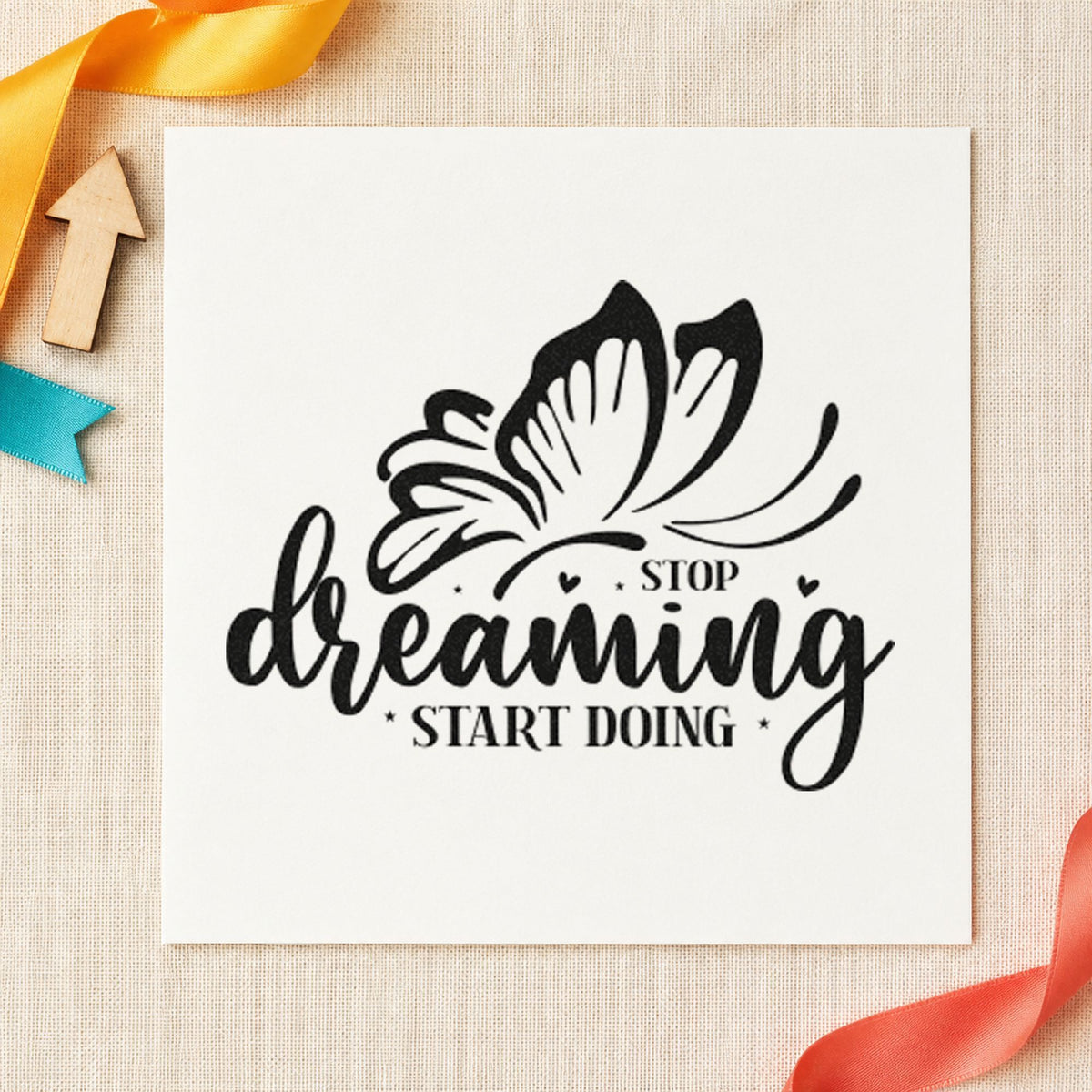 Stop Dreaming Start Doing Butterfly craft stamp imprint in black ink on a handmade project, one idea being sample batch tags.
