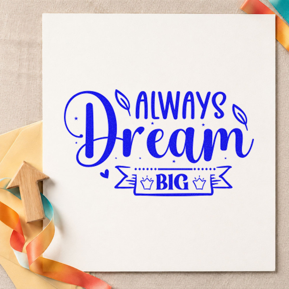 Always Dream Big Crown craft stamp in blue ink on cardstock, an easy option for table skirt printing.