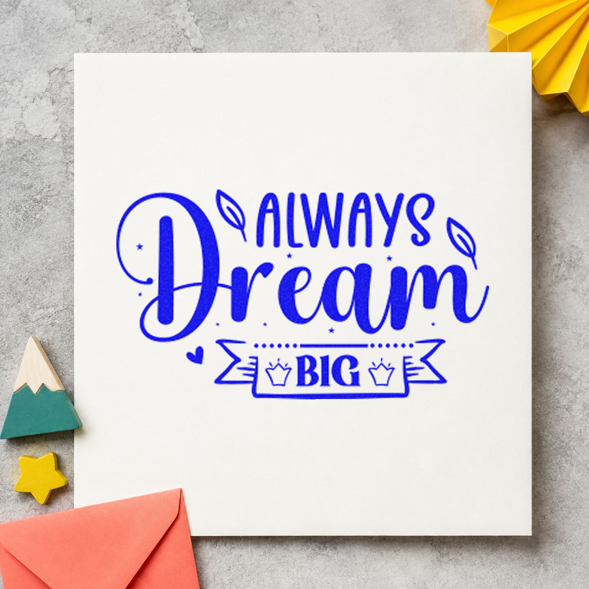Always Dream Big Crown craft stamp imprinted in blue ink on paper, a design suited to framed bedroom shelf.