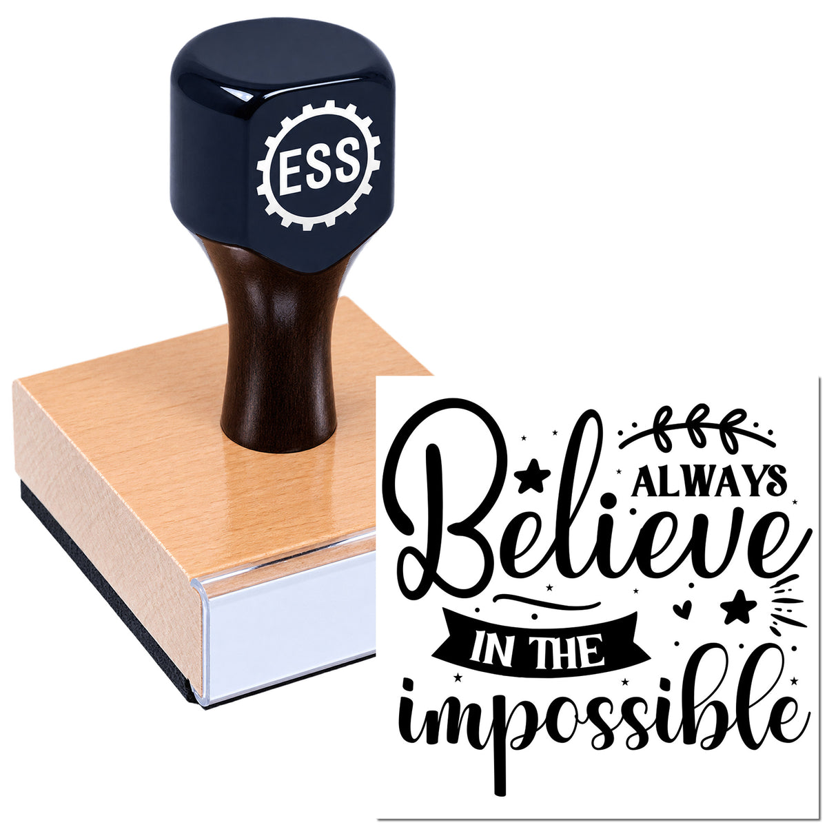 Dark navy custom rubber stamp on a wood block, with black seal text reading "Believe in the impossible" and ESS gear logo.