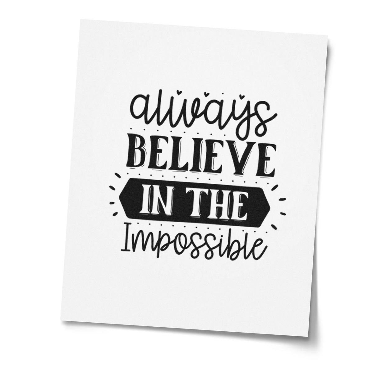 Black custom stamp seal on white paper with Always Believe in the Impossible in bold script and serif lettering.
