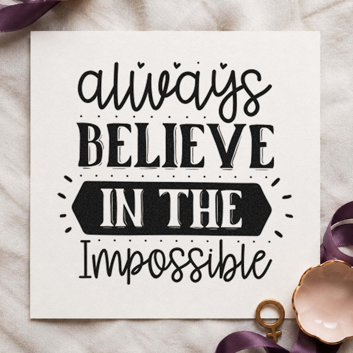 Always Believe In The Impossible craft stamp imprint in black ink on a handmade project, one idea being spare part gift tags.