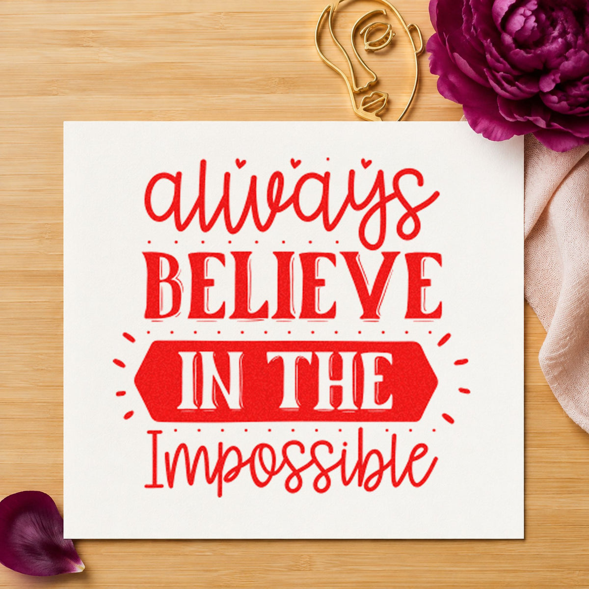 Always Believe In The Impossible rubber stamp shown in red ink, stamped for projects such as bin component labels.