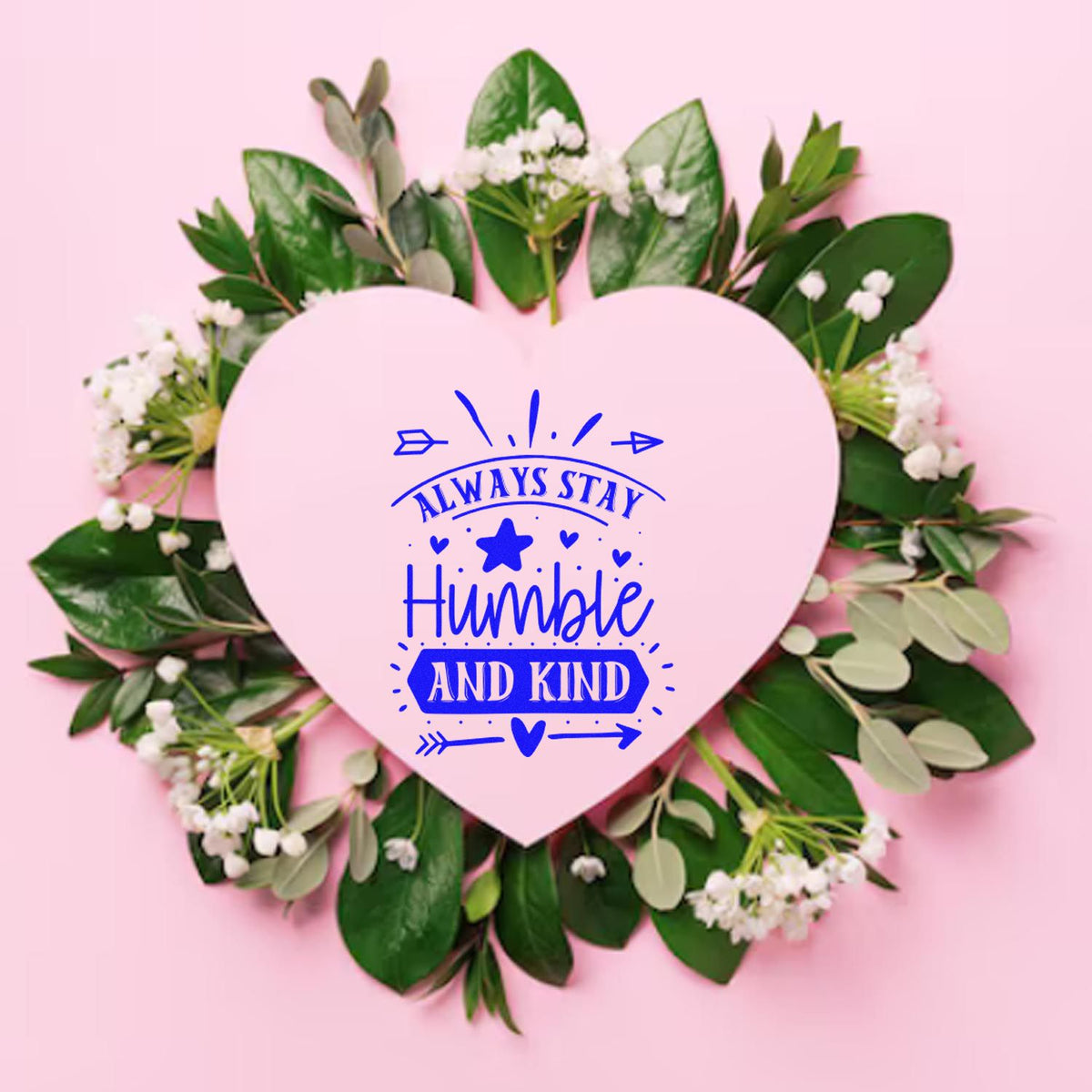 Pink heart-shaped custom stamp seal with blue Always stay humble and kind text, framed by green leaves and white flowers.