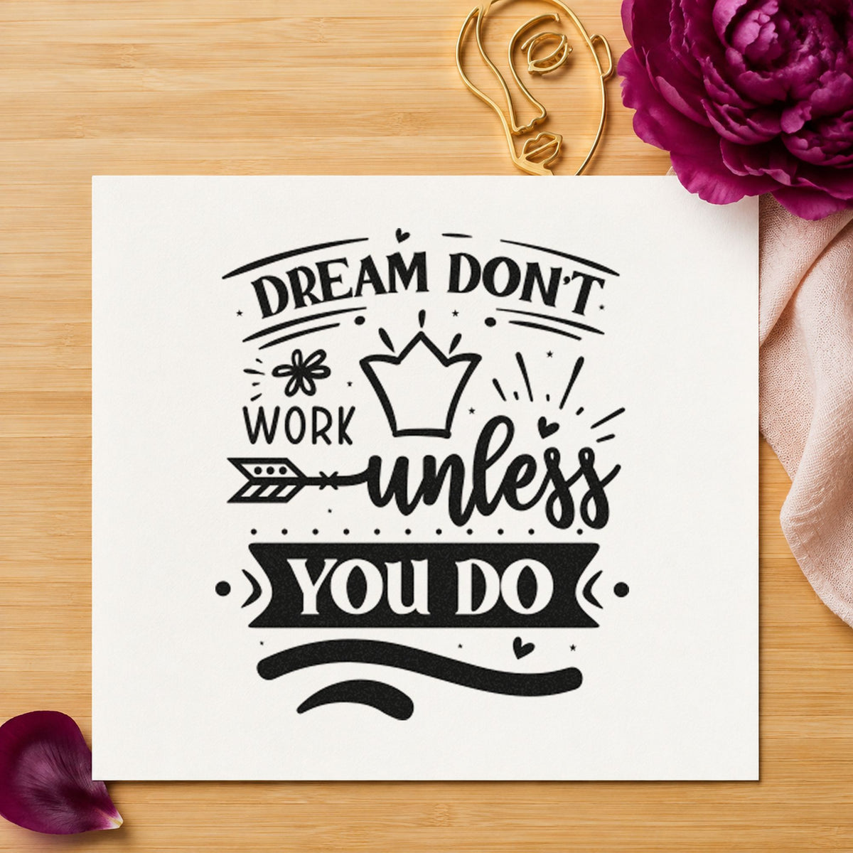 Dream Don't Work Unless You Do craft stamp imprint in black ink on a handmade project, one idea being headset gift tags.