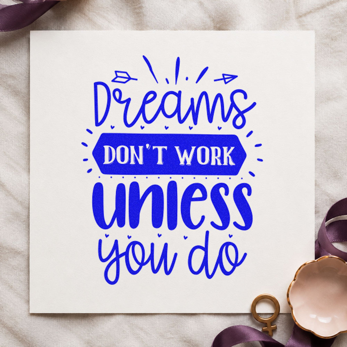 Dreams Don't Work Unless You Do craft stamp in blue ink on cardstock, an easy option for desk runner printing.
