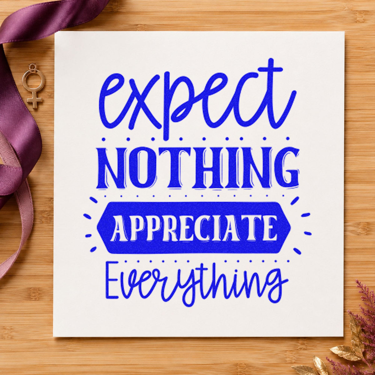 Expect Nothing Appreciate Everything craft stamp in blue ink on cardstock, an easy option for linen cloth printing.