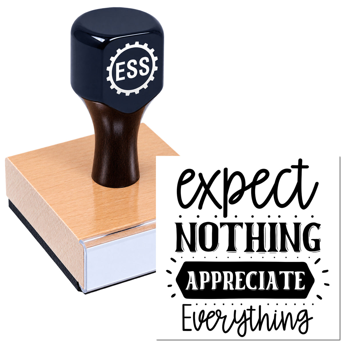 Dark navy ESS rubber stamp with pink wooden base and black seal text: expert nothing appreciate everything.