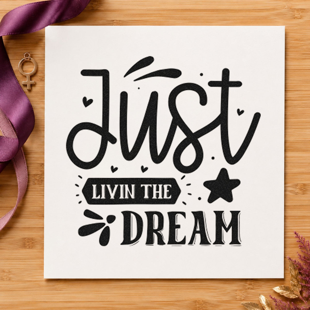 Just Livin The Dream Star craft stamp imprint in black ink on a handmade project, one idea being rental key gift tags.