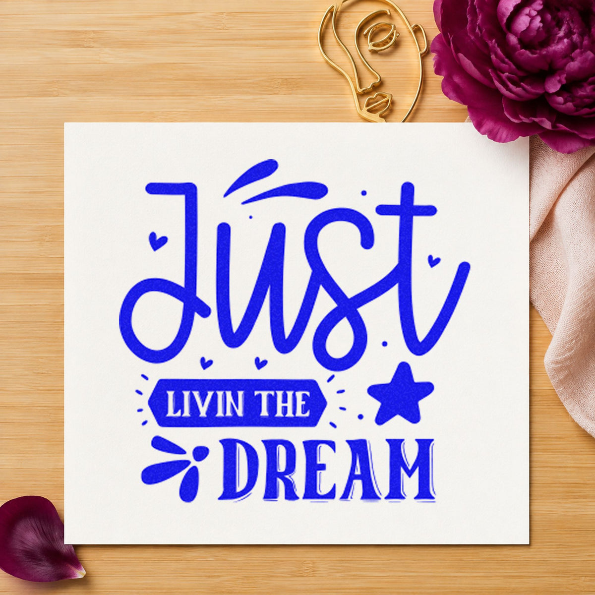 Just Livin The Dream Star craft stamp in blue ink on cardstock, an easy option for dock flag printing.