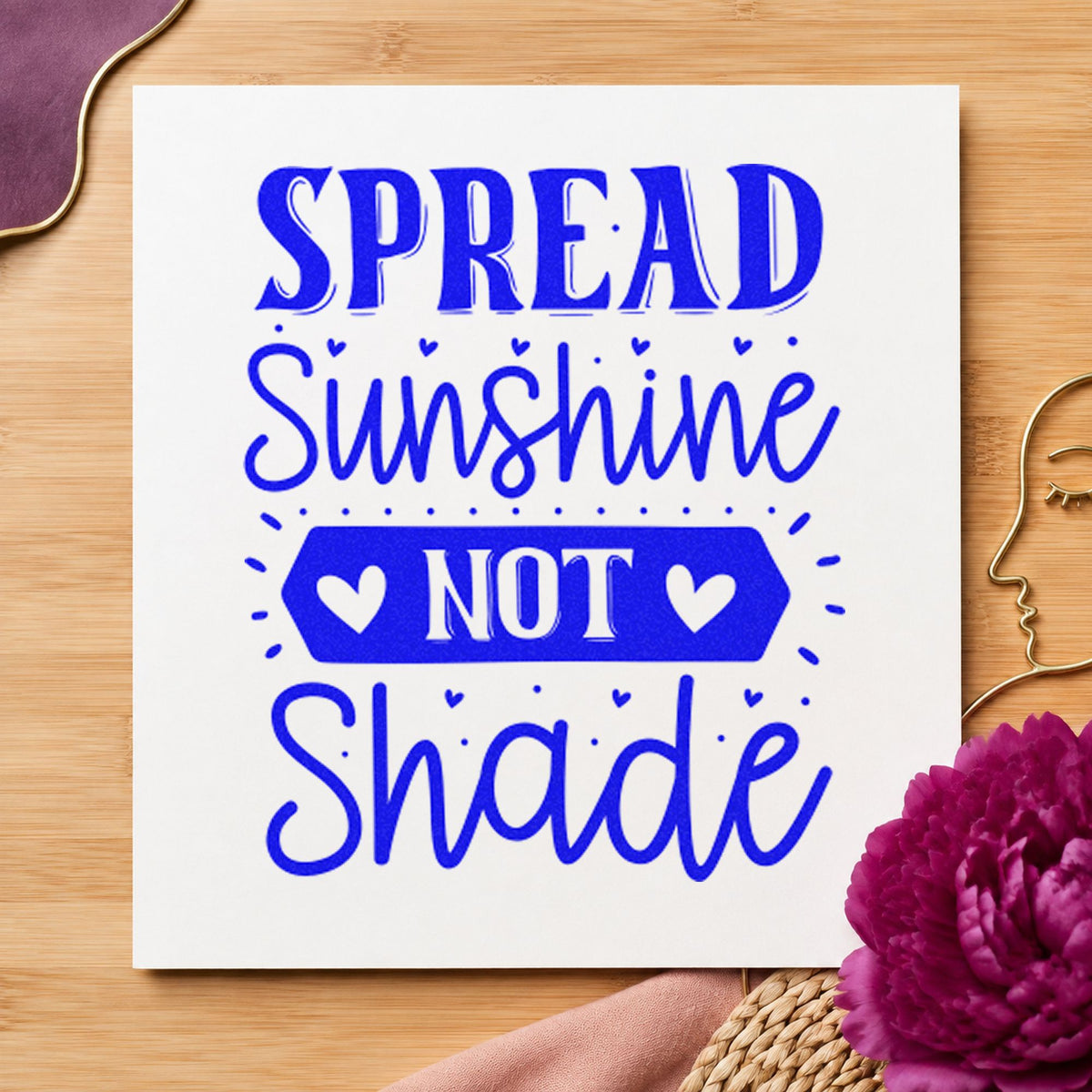 Spread Sunshine Not Shade Hearts craft stamp in blue ink on cardstock, an easy option for guard tee printing.