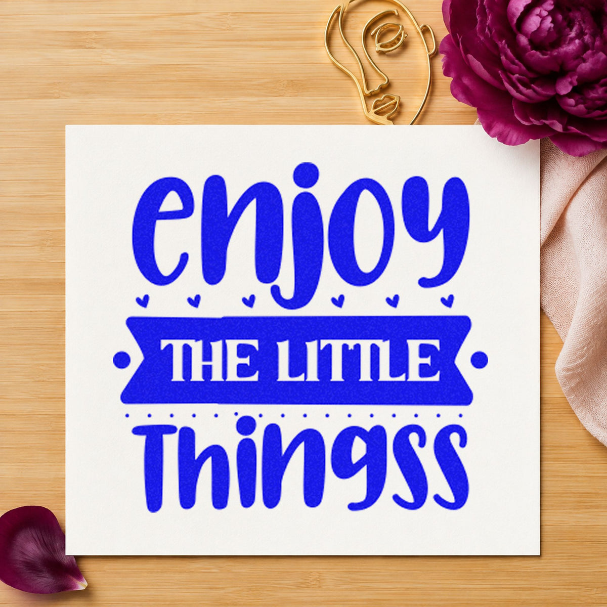 Enjoy The Little Things Bold craft stamp in blue ink on cardstock, an easy option for tray liner printing.