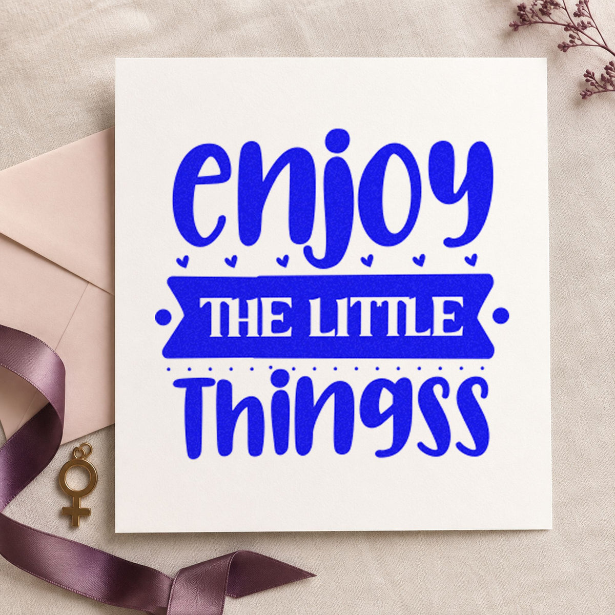 Enjoy The Little Things Bold craft stamp imprinted in blue ink on paper, a design suited to framed display case.