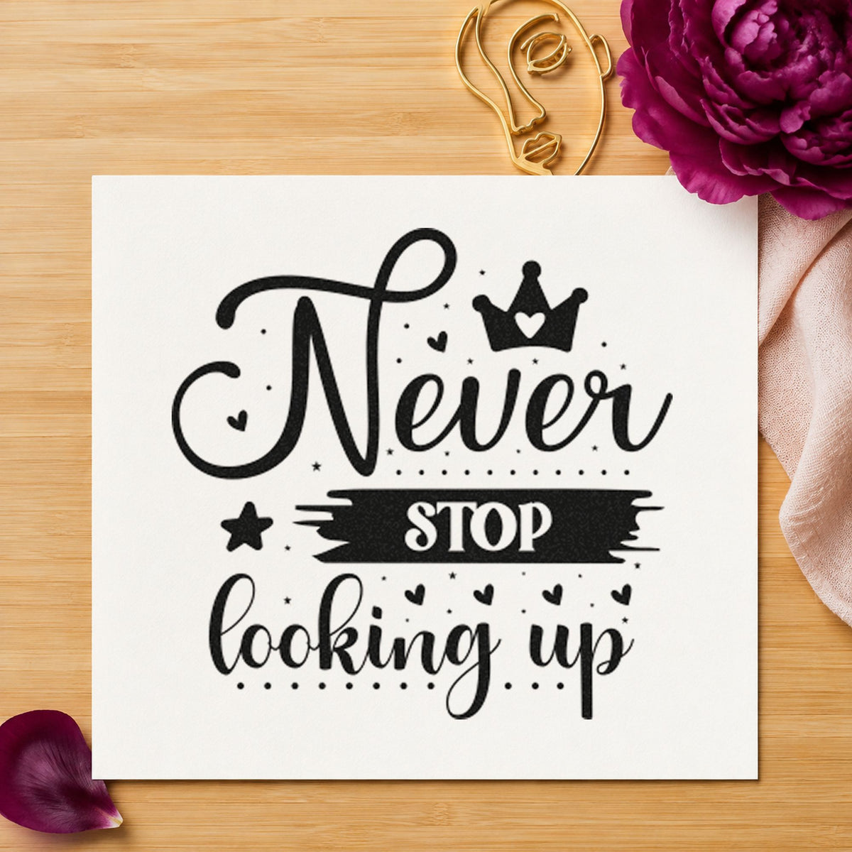 Never Stop Looking Up Crown craft stamp imprint in black ink on a handmade project, one idea being rope bag gift tags.