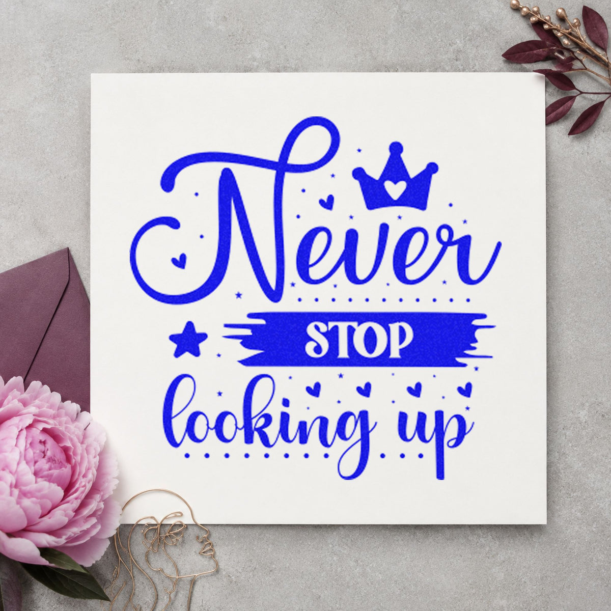 Never Stop Looking Up Crown craft stamp in blue ink on cardstock, an easy option for kit bag printing.