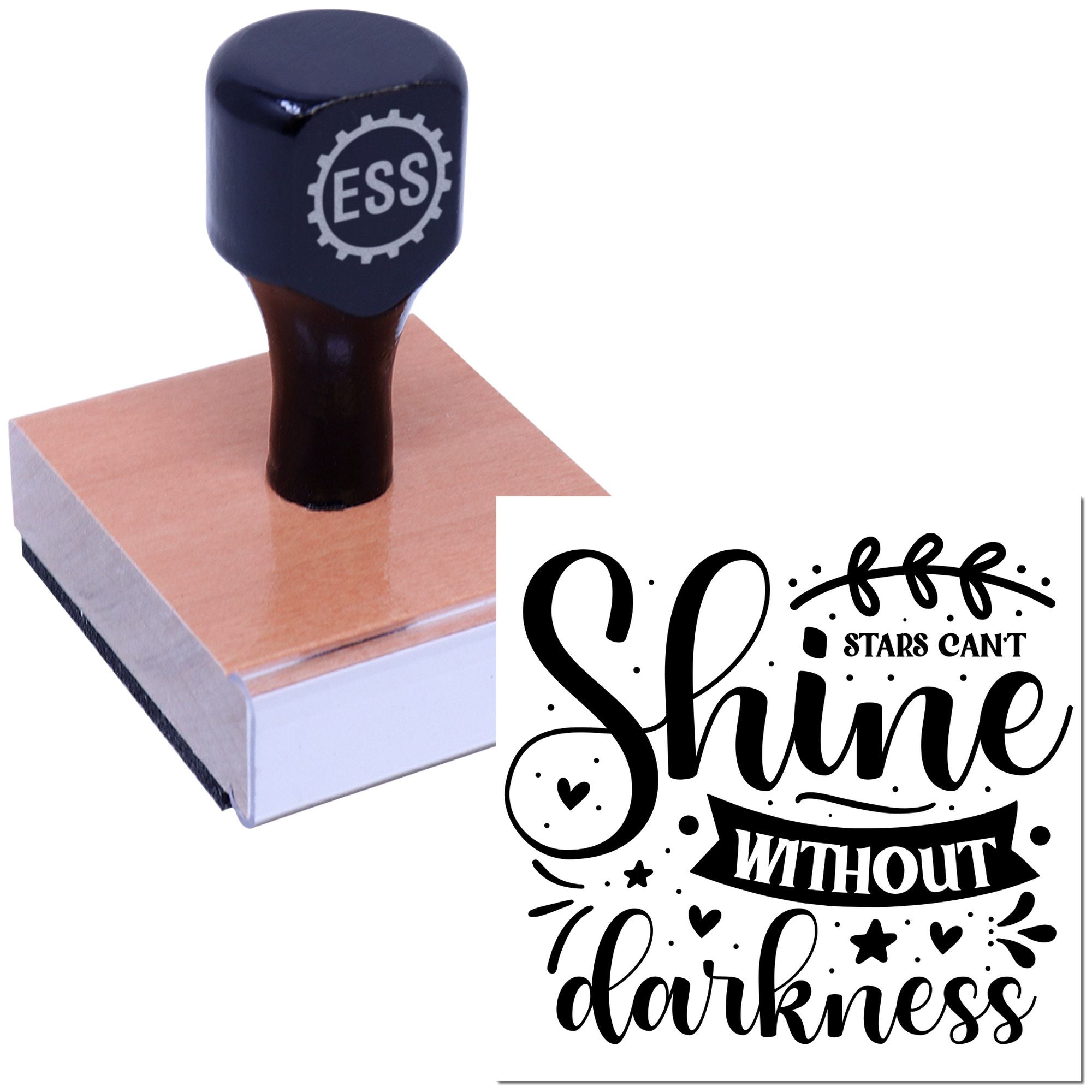 Black self-inking stamp on a pink seal pad with Stars cant shine without darkness design, white background.
