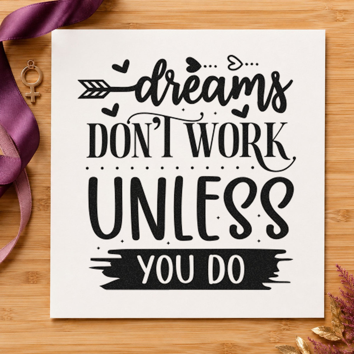 Dreams Don't Work Unless You Do craft stamp imprint in black ink on a handmade project, one idea being kit case gift tags.
