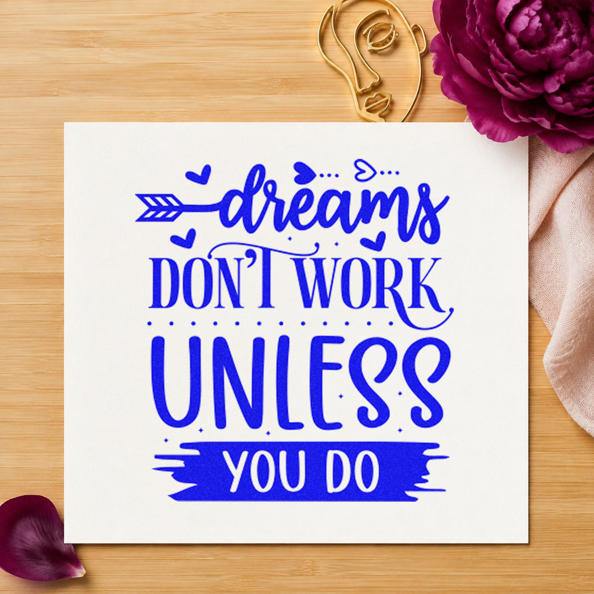 Dreams Don't Work Unless You Do craft stamp in blue ink on cardstock, an easy option for work cape printing.