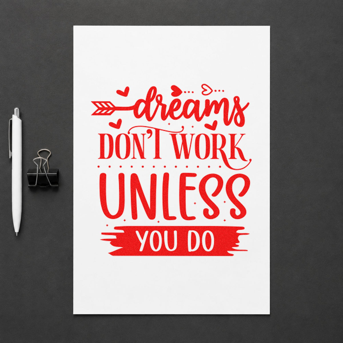 Dreams Don't Work Unless You Do craft stamp imprint in red ink on a handmade project, one idea being practice model cards.