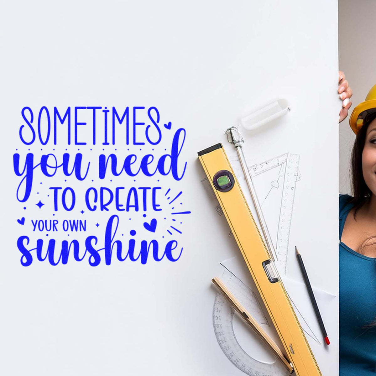 Blue quote on white board with yellow stamp and seal tools, ruler, pencil, and drafting set.