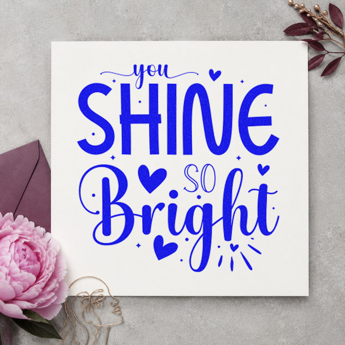 You Shine So Bright craft stamp in blue ink on cardstock, an easy option for garment bag printing.