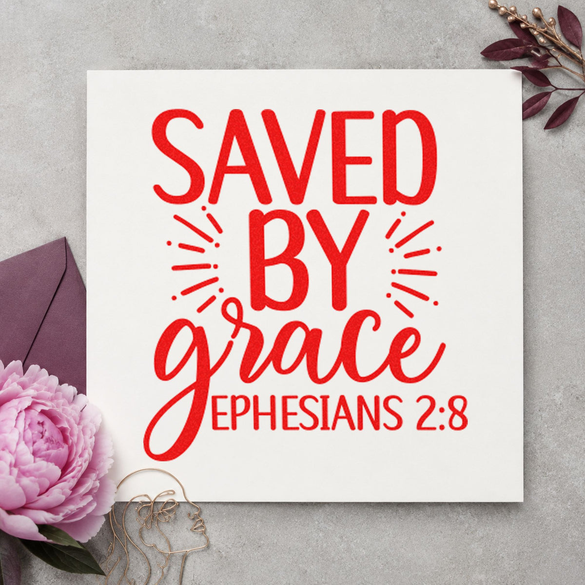 Saved By Grace Ephesians craft stamp imprint in red ink on a handmade project, one idea being connect slip cards.