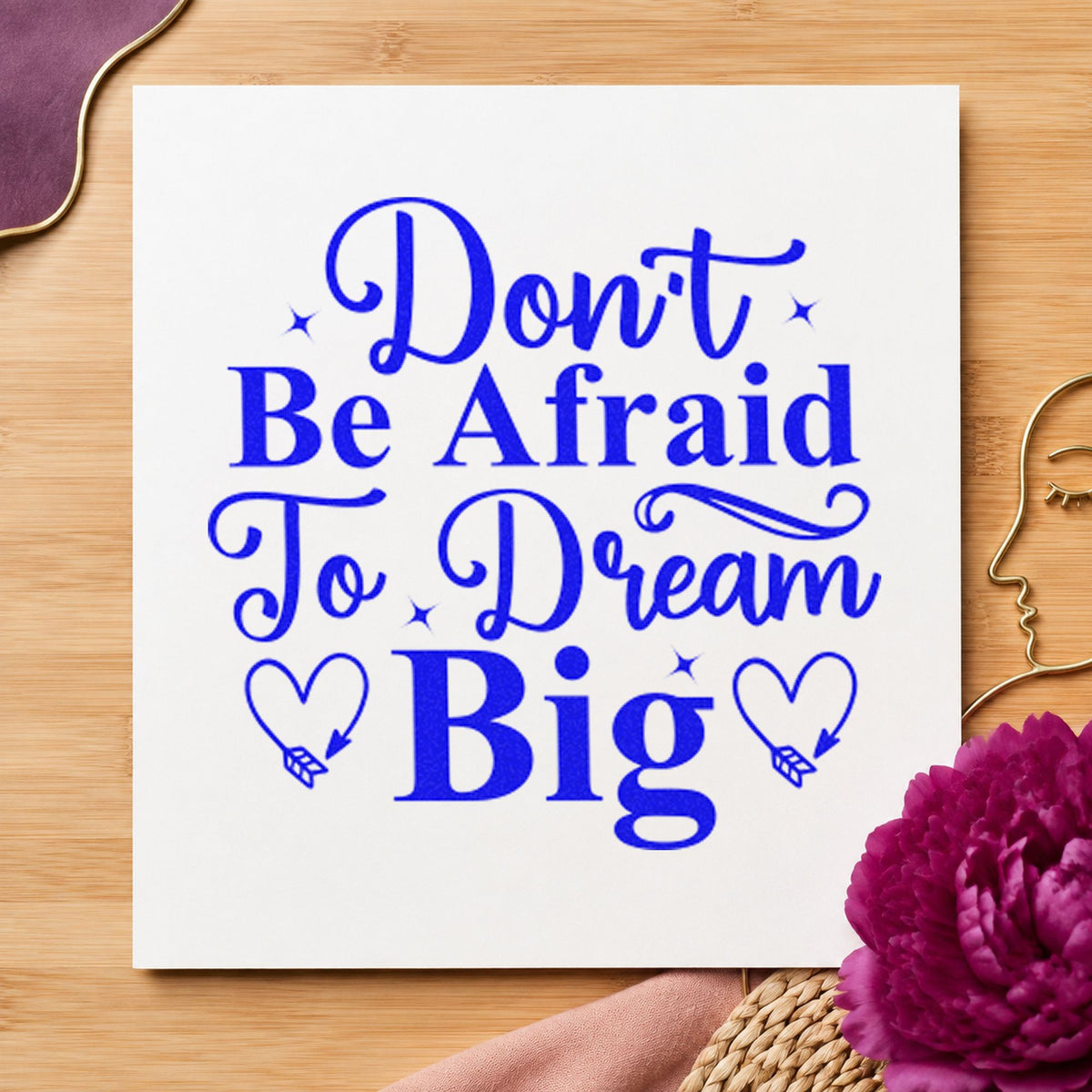 Don't Be Afraid Dream Big craft stamp imprinted in blue ink on paper, a design suited to framed school hall.