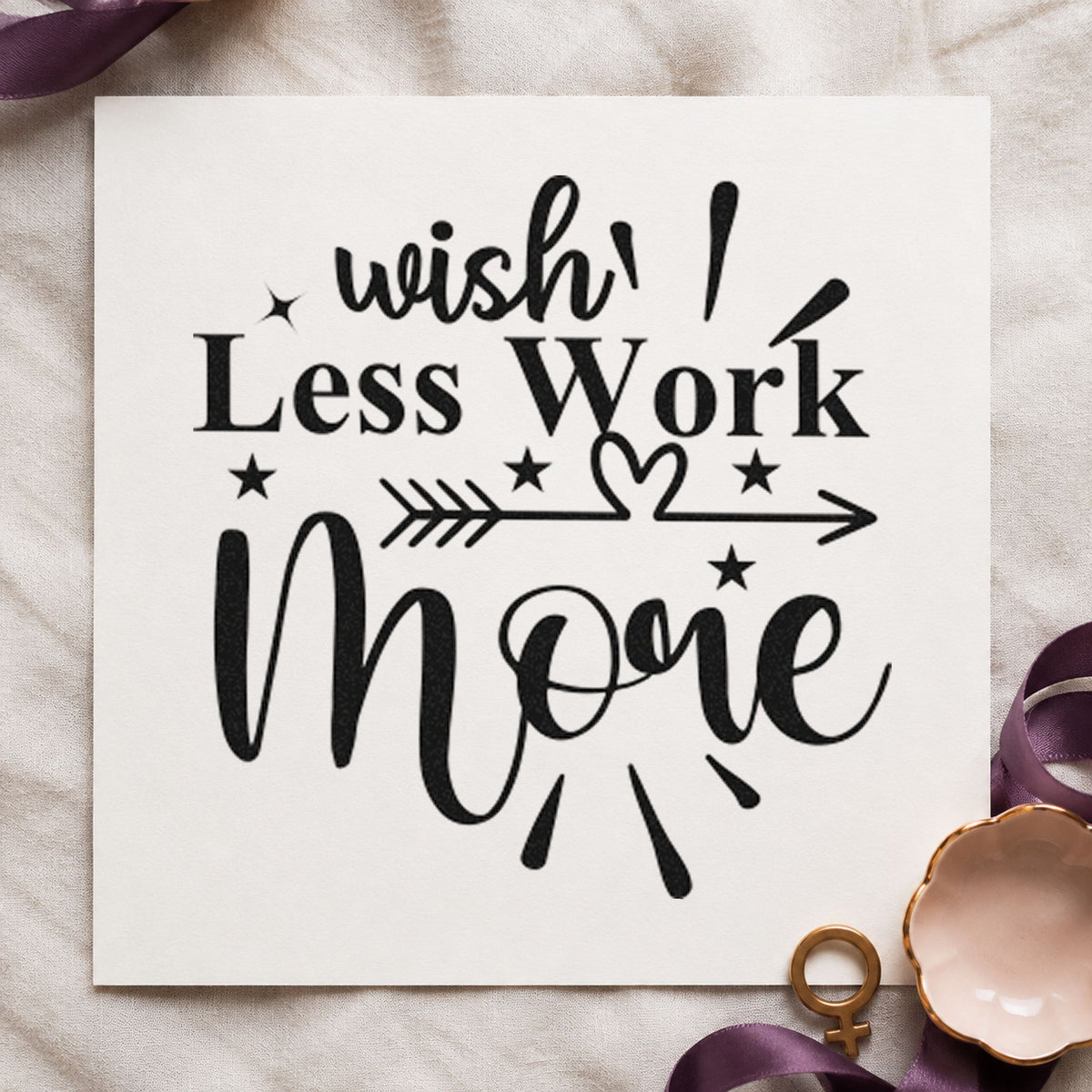 Wish Less Work More Arrow craft stamp imprint in black ink on a handmade project, one idea being flyer bundle tags.