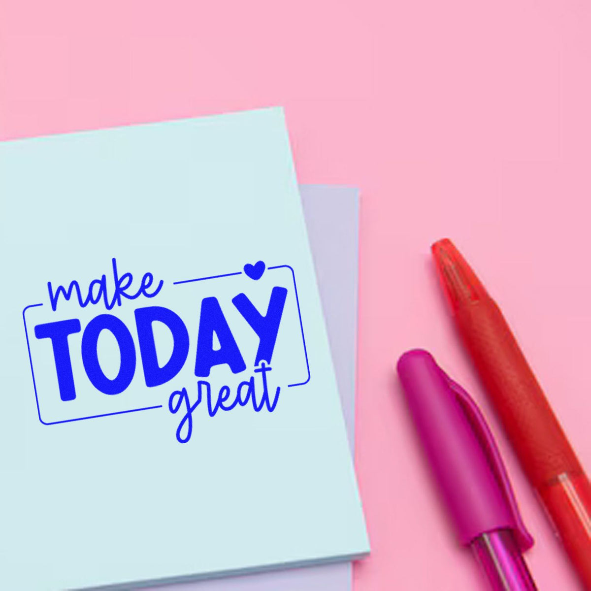 Blue motivational stamp seal reading make TODAY great on a light blue card, with red and magenta pens on a pink background.