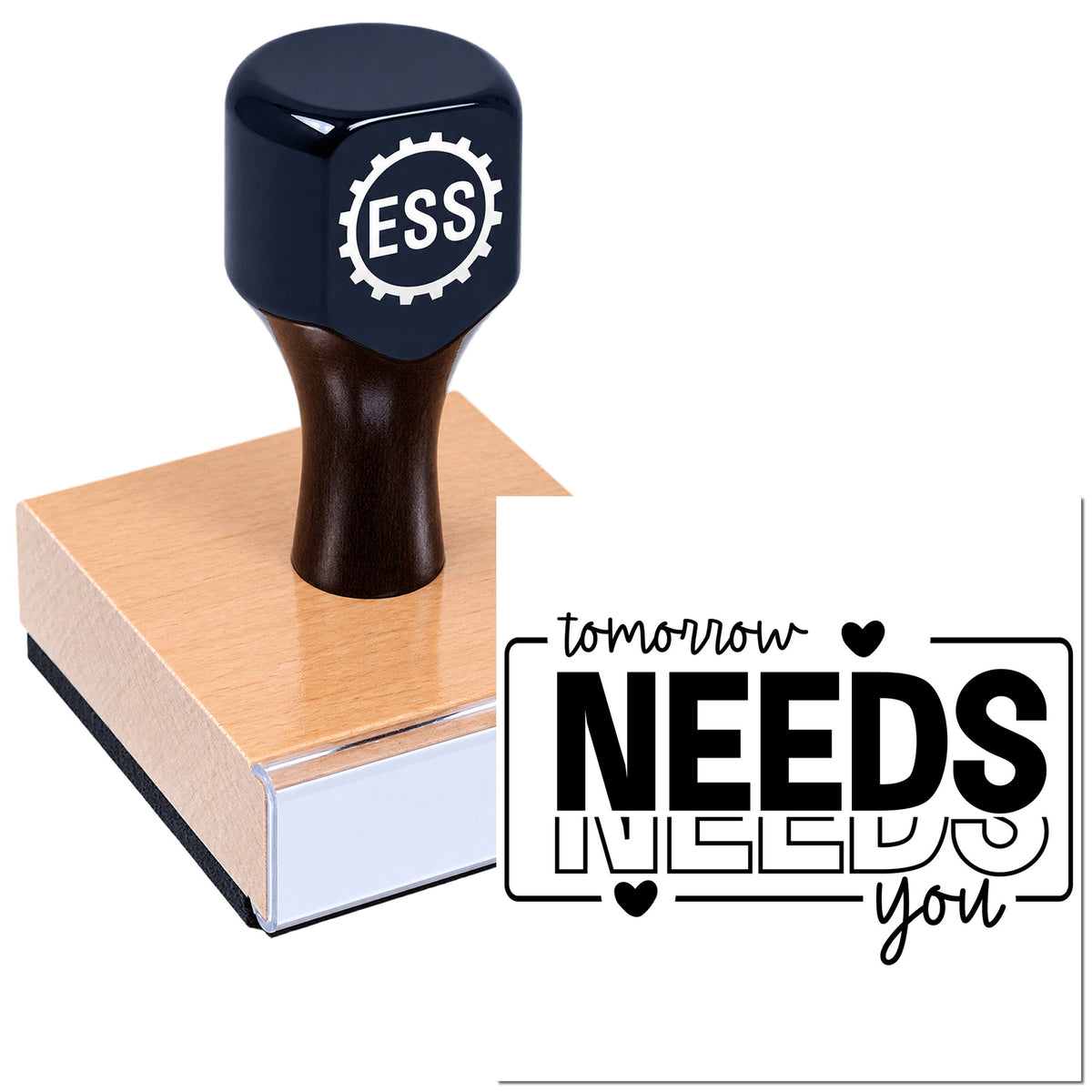 Black ESS seal stamp on copper block, showing "Tomorrow Needs You" in black script with hearts on a white background.