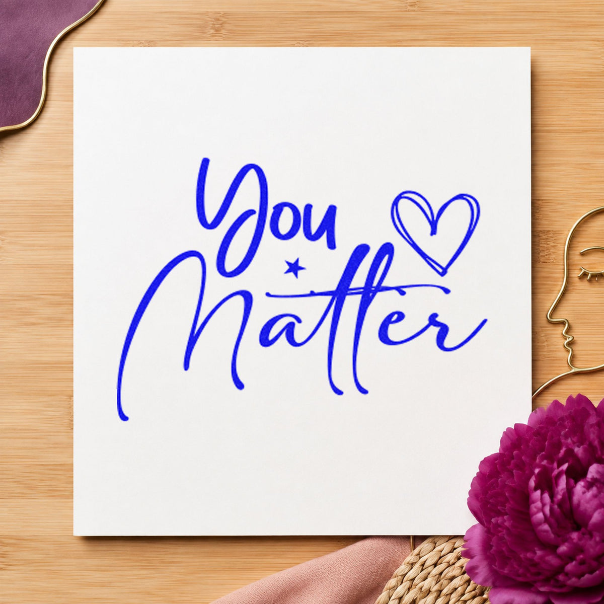 You Matter Heart Star craft stamp imprinted in blue ink on paper, a design suited to framed program office.