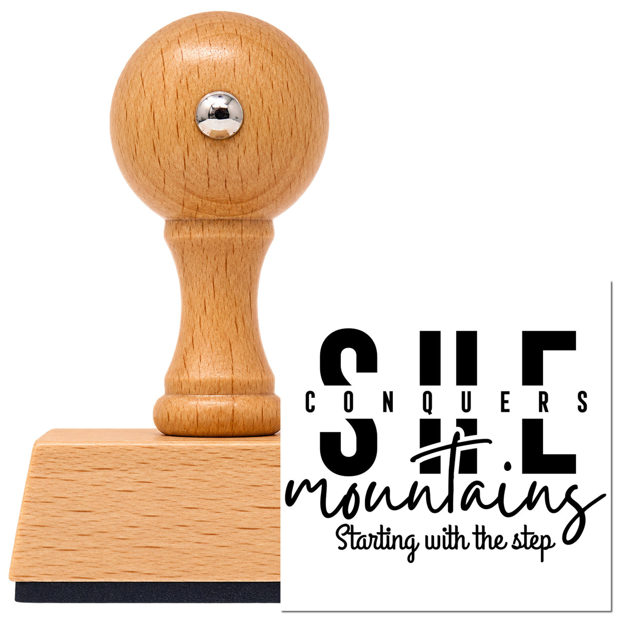 Vintage Pro beech wood stamp with a round knob handle, shown with its black She Conquers Mountains Step imprint on white.
