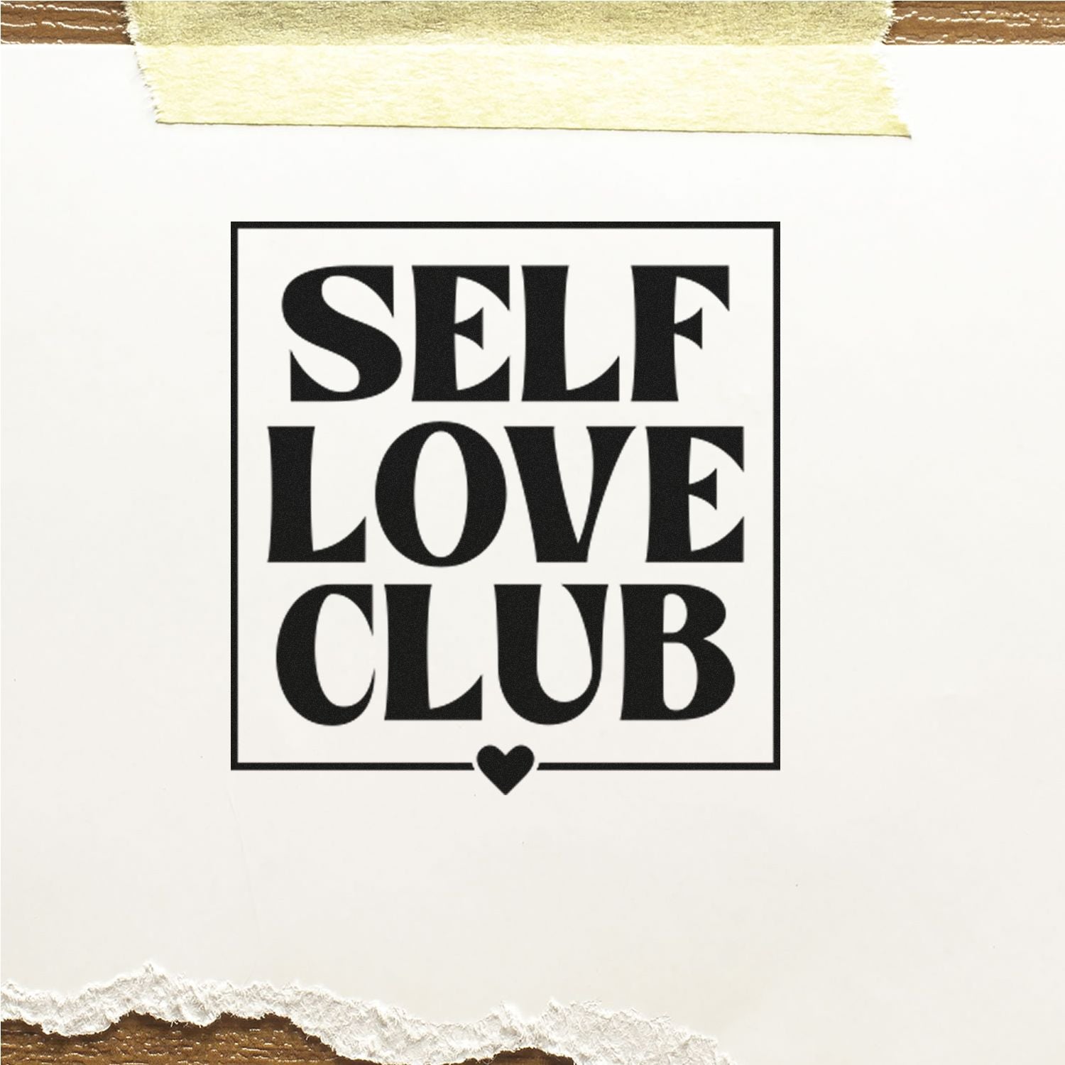 Black SELF LOVE CLUB stamp and seal design with heart icon on white paper, taped top and torn bottom edge.