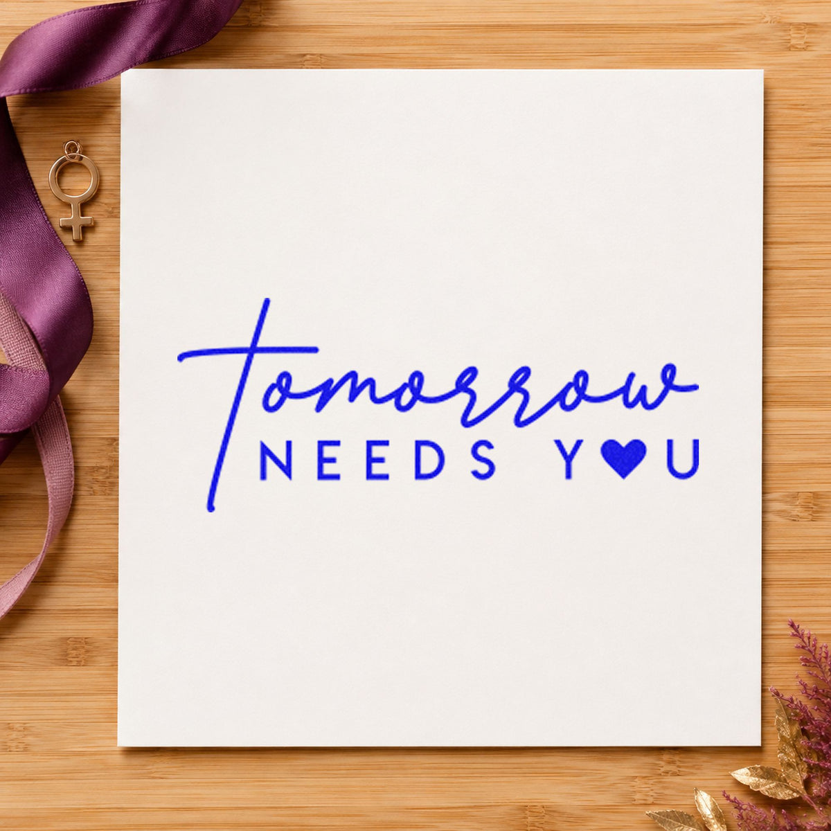 Tomorrow Needs You Heart craft stamp in blue ink on cardstock, an easy option for club tabard printing.