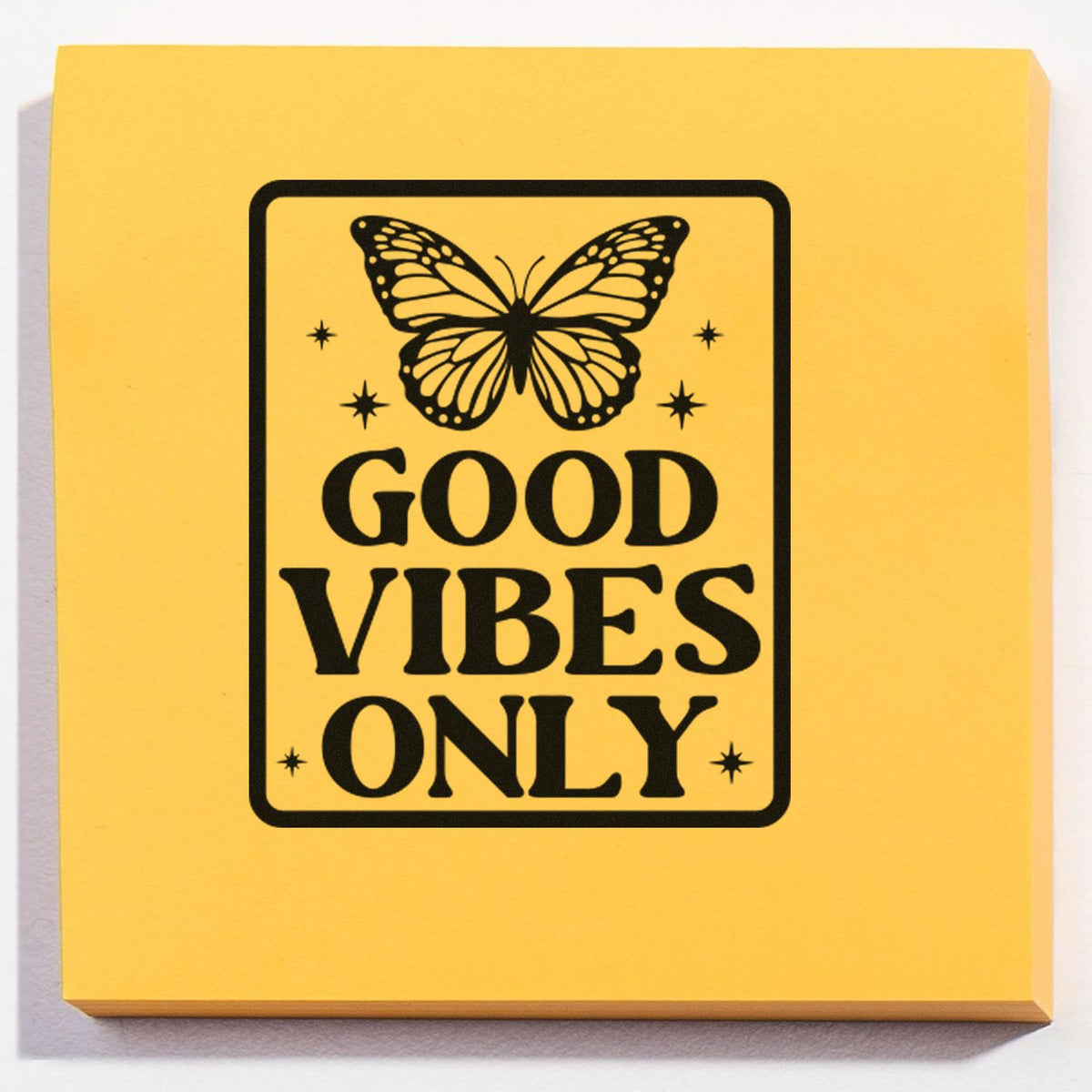 Yellow stamp and seal product with black butterfly, stars, and bold GOOD VIBES ONLY lettering.