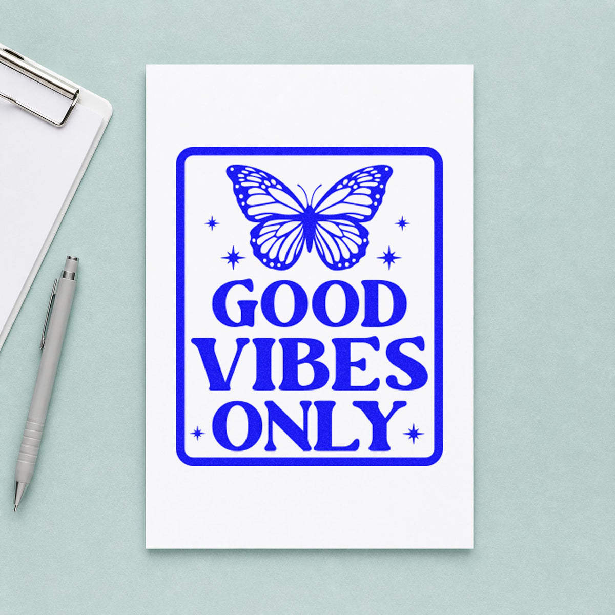 Good Vibes Only Butterfly craft stamp imprinted in blue ink on paper, a design suited to framed locker door.